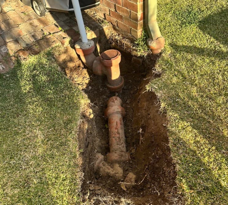 Old clay drainage pipework exposed ahead of a residential upgrade in Kiama