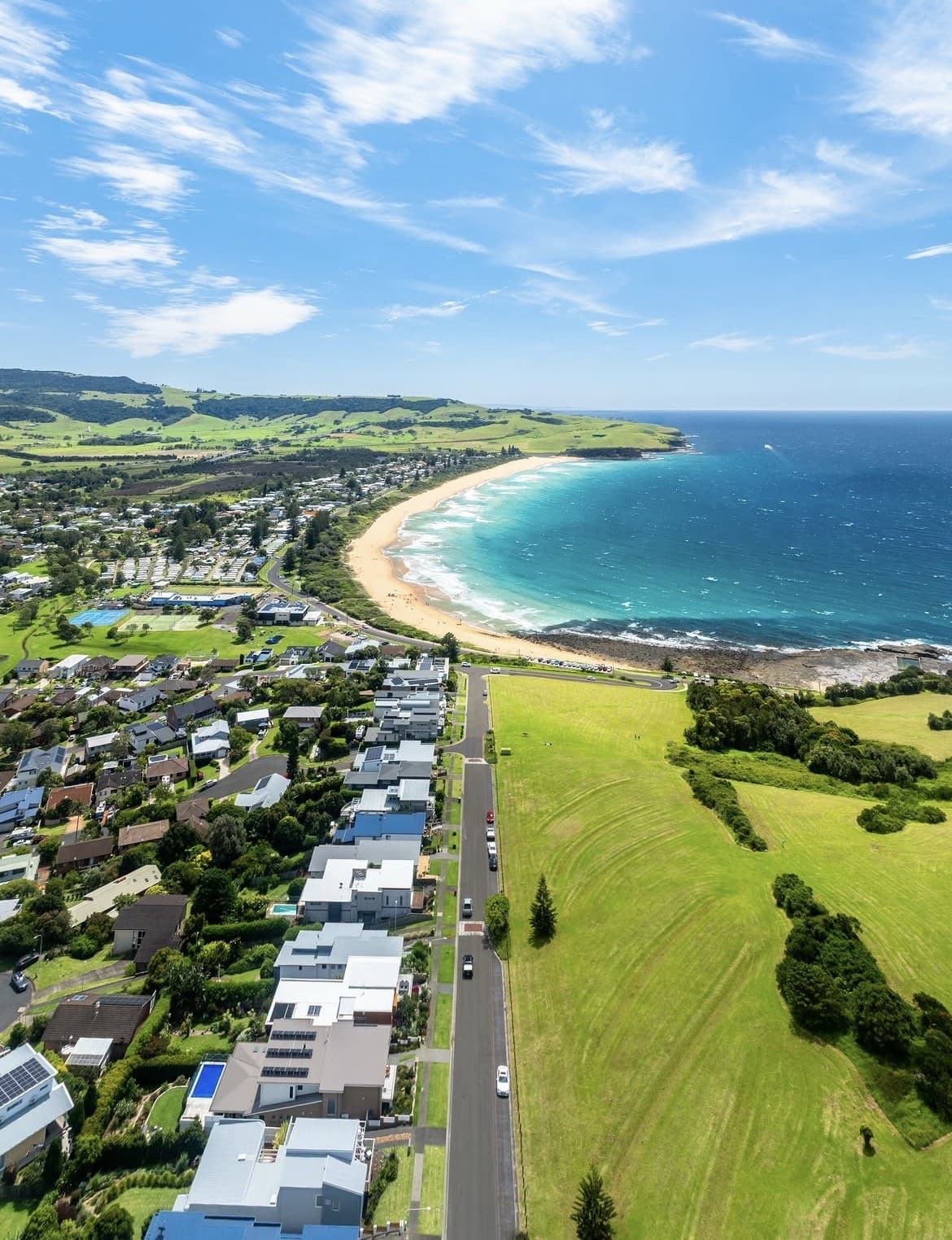 Aerial view of the Kiama coastline, NSW, showing the beach, headland and coastal homes